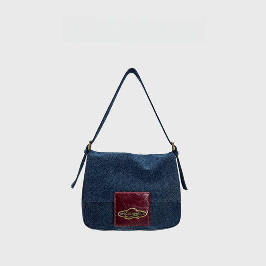 Original Denim and Leather Hand Bag with a Glossy Logo Patch Design in Blue Denim with a Glossy Burgundy Leather Patch and Sleek Flap Design - Stylish, Urban for Casual Outings, Shopping, Everyday Use for Women